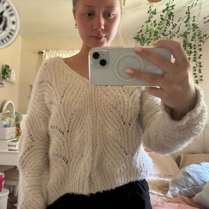 a white pink rose sweater